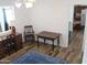 Bright bedroom with wooden desk and chair and a view to the kitchen at 235 N 61St Pl, Mesa, AZ 85205