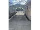 Spacious carport providing covered parking and protection from the elements with gated entrance at 235 N 61St Pl, Mesa, AZ 85205