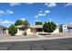 Charming single story home with mature landscaping in the front yard at 235 N 61St Pl, Mesa, AZ 85205