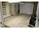 Spacious two car garage with block brick walls and tile accent at 235 N 61St Pl, Mesa, AZ 85205