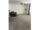 Bright living room with plush carpet, ceiling fan and room for entertaining or relaxing at 235 N 61St Pl, Mesa, AZ 85205