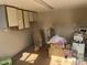 Interior view of a cluttered shed, with shelving units and various items stored within at 235 N 61St Pl, Mesa, AZ 85205