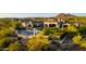 Aerial view of a luxury home with a pool, lush landscaping, and mountain backdrop at 24066 N 90Th Way, Scottsdale, AZ 85255