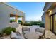 Inviting outdoor living space with travertine patio, built-in BBQ, and tranquil mountain views at 24066 N 90Th Way, Scottsdale, AZ 85255