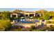 Lush backyard with a sparkling pool, manicured landscaping, and mountain views at 24066 N 90Th Way, Scottsdale, AZ 85255