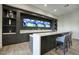 This bar area features a long counter, pendant lighting, and stylish cabinetry, perfect for hosting at 24066 N 90Th Way, Scottsdale, AZ 85255
