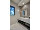Modern bathroom featuring a floating vanity, stylish pendant lights, and contemporary finishes at 24066 N 90Th Way, Scottsdale, AZ 85255
