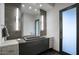 This contemporary bathroom features a dual sink vanity, sleek lighting, and modern fixtures at 24066 N 90Th Way, Scottsdale, AZ 85255