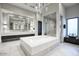 Bright bathroom with large soaking tub, walk-in shower, and a modern double sink vanity at 24066 N 90Th Way, Scottsdale, AZ 85255