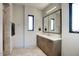 Well-lit bathroom featuring sleek fixtures, a large mirror, and modern design elements at 24066 N 90Th Way, Scottsdale, AZ 85255