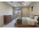 Cozy bedroom with mountain views, soft carpet, and a ceiling fan for added comfort at 24066 N 90Th Way, Scottsdale, AZ 85255