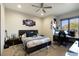 Spacious bedroom with a view featuring a comfortable bed, stylish decor, and natural light at 24066 N 90Th Way, Scottsdale, AZ 85255