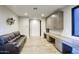 Versatile bonus room with custom built-ins, a comfortable sofa, and plenty of space to work or relax at 24066 N 90Th Way, Scottsdale, AZ 85255