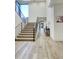 Bright entryway featuring a modern staircase with metal railings and light wood flooring at 24066 N 90Th Way, Scottsdale, AZ 85255