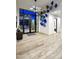 Inviting foyer with modern lighting, wood flooring, and contemporary wall art at 24066 N 90Th Way, Scottsdale, AZ 85255