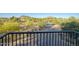 Balcony view showcasing the lush desert landscaping with mature trees and mountain views at 24066 N 90Th Way, Scottsdale, AZ 85255