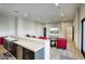 This open-concept living room includes a bar area, plenty of seating, and an entertainment center at 24066 N 90Th Way, Scottsdale, AZ 85255