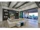 Bright living room with modern sectional, fireplace, and seamless indoor-outdoor flow to the patio at 24066 N 90Th Way, Scottsdale, AZ 85255