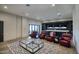 Relax in this living room with leather chairs, a modern glass table, and a built-in entertainment center at 24066 N 90Th Way, Scottsdale, AZ 85255
