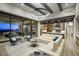 Spacious living room with modern furnishings, fireplace, open to the kitchen, and expansive outdoor views at 24066 N 90Th Way, Scottsdale, AZ 85255