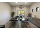 Modern home office setup with sleek desks, hardwood floors, and natural light at 24066 N 90Th Way, Scottsdale, AZ 85255