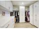 Organized walk-in closet with custom shelves, drawers, and ample storage space at 24066 N 90Th Way, Scottsdale, AZ 85255
