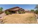 Large backyard showcasing rock landscaping, a covered patio, and privacy at 25667 W Primrose Ln, Buckeye, AZ 85326