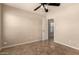 Charming bedroom with tile floors, neutral paint, ceiling fan and convenient closet access at 25667 W Primrose Ln, Buckeye, AZ 85326