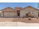 Charming single-story home with a brick-paved driveway and beautiful desert landscaping at 25667 W Primrose Ln, Buckeye, AZ 85326