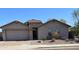 Charming single-Gathering home with stone accents, a two-car garage, and well maintained desert landscaping at 25667 W Primrose Ln, Buckeye, AZ 85326