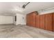 Spacious garage with ample storage cabinets and overhead lighting at 25667 W Primrose Ln, Buckeye, AZ 85326