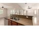 Kitchen bar with views to the backyard, tile flooring, and stainless dishwasher at 25667 W Primrose Ln, Buckeye, AZ 85326
