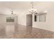 Spacious living area featuring tile flooring, a ceiling fan, and an open layout at 25667 W Primrose Ln, Buckeye, AZ 85326