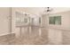 Bright and airy living room with tile floors, vaulted ceiling, and large windows at 25667 W Primrose Ln, Buckeye, AZ 85326