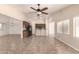 Open concept living room features bar seating, tile floors, neutral walls, and recessed lighting at 25667 W Primrose Ln, Buckeye, AZ 85326