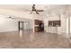 Spacious living area featuring an open floor plan, neutral walls, and tile flooring at 25667 W Primrose Ln, Buckeye, AZ 85326