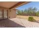 A covered patio provides a shaded outdoor space, transitioning to the backyard and fence at 25667 W Primrose Ln, Buckeye, AZ 85326