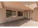 Covered patio with a brick floor, windows, and a door to the house at 25667 W Primrose Ln, Buckeye, AZ 85326