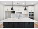 Bright kitchen featuring white countertops and cabinets, complemented by stainless steel appliances at 25894 W White Feather Ln, Wittmann, AZ 85361