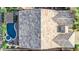 Detailed aerial view of a home with a colorful tile roof and a backyard pool and patio area at 31107 N 27Th Ave, Phoenix, AZ 85085