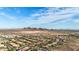 Wide aerial shot showcasing the community homes, the desert landscape, and distant mountain views at 31107 N 27Th Ave, Phoenix, AZ 85085
