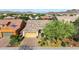 Aerial view of a home with desert landscaping, tile roof, and solar panels in a suburban community at 31107 N 27Th Ave, Phoenix, AZ 85085