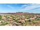Beautiful aerial view of the neighborhood with mountains in the distance and blue skies above at 31107 N 27Th Ave, Phoenix, AZ 85085