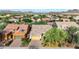 Aerial view of a suburban home with desert landscaping, tile roofs, and views of the surrounding mountains at 31107 N 27Th Ave, Phoenix, AZ 85085
