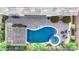 Aerial view of a luxurious backyard featuring a pool, spa, covered patio, and beautiful, desert-friendly landscaping at 31107 N 27Th Ave, Phoenix, AZ 85085