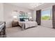 This bedroom has large windows and a decorative chandelier at 31107 N 27Th Ave, Phoenix, AZ 85085