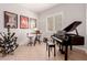 This bonus room features a piano and wine rack, perfect for entertaining at 31107 N 27Th Ave, Phoenix, AZ 85085