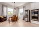 Inviting breakfast nook with wine fridge, barrel table, and ample natural light streaming through the windows at 31107 N 27Th Ave, Phoenix, AZ 85085