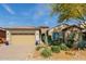 Beautiful single-story home boasting desert-style landscaping, a two-car garage, and a welcoming entrance at 31107 N 27Th Ave, Phoenix, AZ 85085