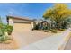 Attractive home with a tile roof, desert landscaping, and a convenient two-car garage at 31107 N 27Th Ave, Phoenix, AZ 85085